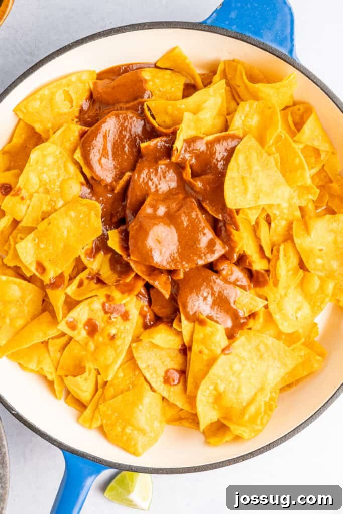 Decadent Mole Chilaquiles 6 Stir to coat the chips.