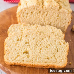 A close-up image of a perfectly baked slice of Beer Quick Bread, highlighting its soft interior.