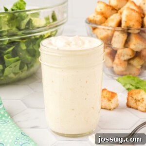 Homemade Caesar salad dressing in glass jar
