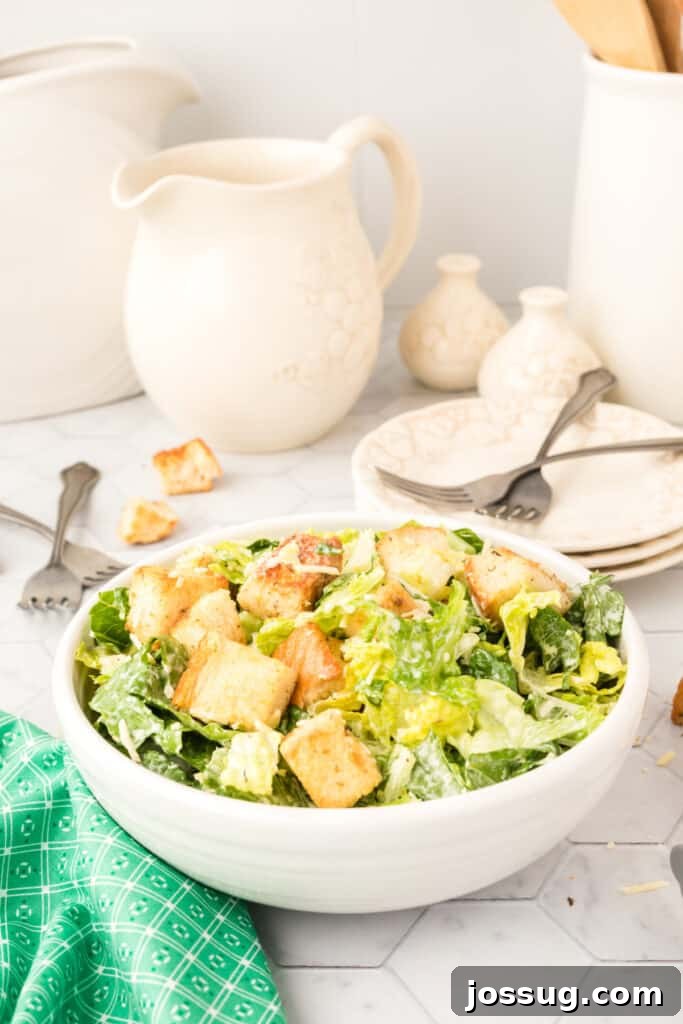 The Emperor's Salad 4 prepared caesar salad in a bowl on a wooden table, with fresh ingredients scattered around