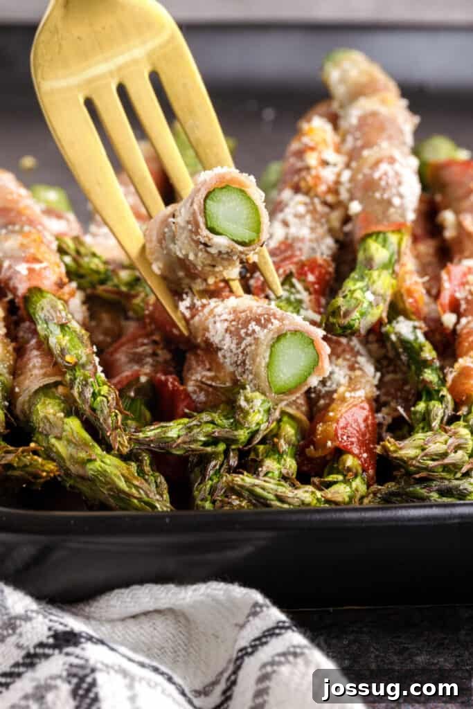 pieces of asparagus on fork