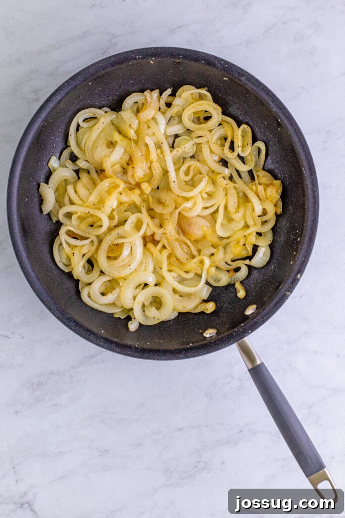 Coke-Kissed Caramelized Onions 3 Sliced onions beginning to soften and brown in a skillet