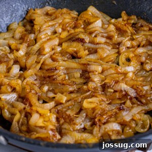 Coke-Kissed Caramelized Onions 7 Closeup of Coca-Cola caramelized onions in a pan
