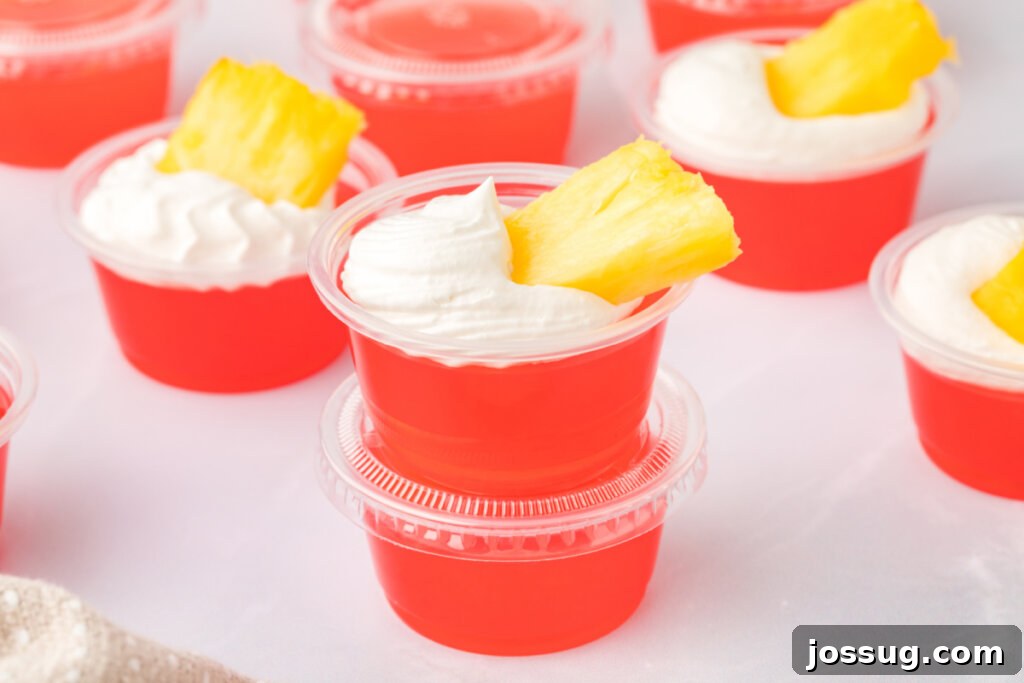 Caribbean Rum Jelly Shooters 6 An inviting spread of rum punch jello shots, individually portioned and ready to be enjoyed at a party.