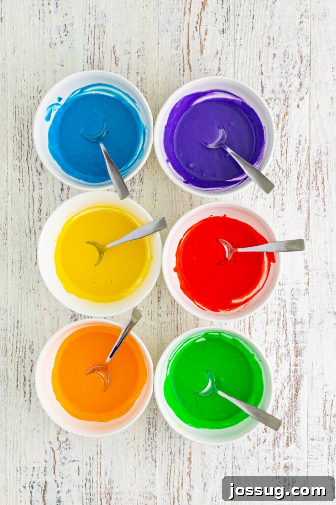 assorted colors of pancake batter in separate bowls