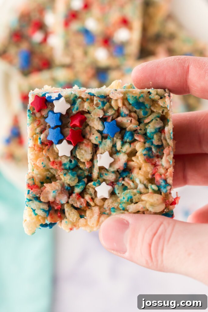 Patriotic Crispy Rice Squares 2 Hand holding a patriotic rice crispy treat