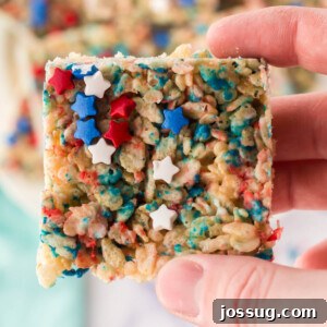closeup of a hand holding a patriotic rice crispy treat