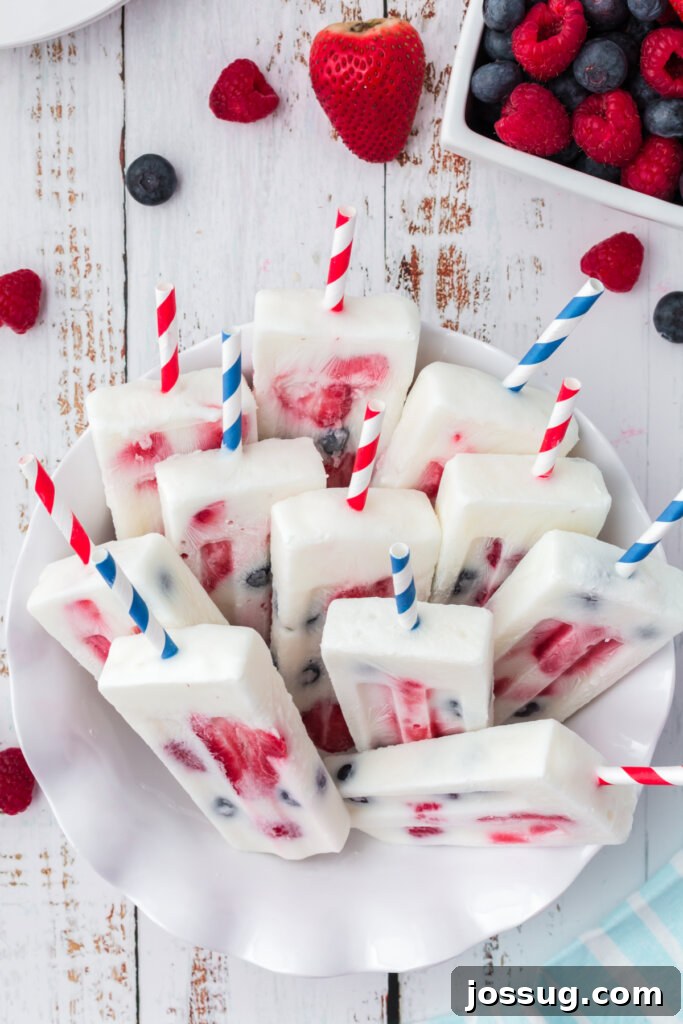 Red White and Blue Berry Pops 4 patriotic berry popsicles on end in bowl