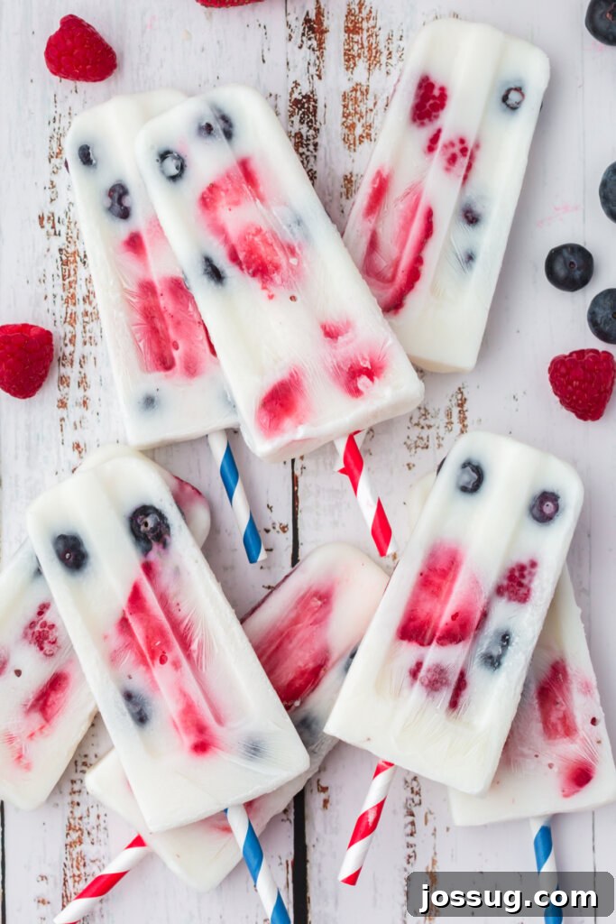 Red White and Blue Berry Pops 5 several popsicles laying stacked on table