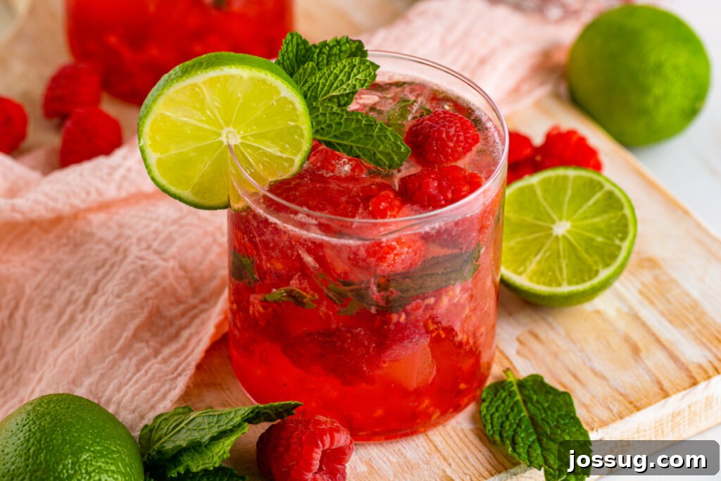A Berry Vodka Smash cocktail elegantly presented on a table, ready to be enjoyed, with a soft background.