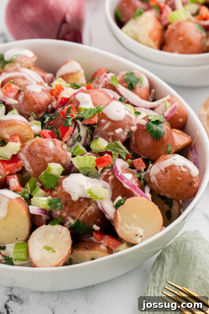 Red Potato Salad in a rustic serving bowl, ready to be enjoyed