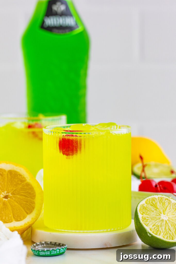 midori sour with a midori bottle in the background
