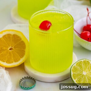 closeup of midori sour cocktail on coaster