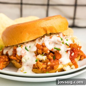 A close-up of a buffalo chicken sloppy joe, highlighting its rich texture and vibrant colors.