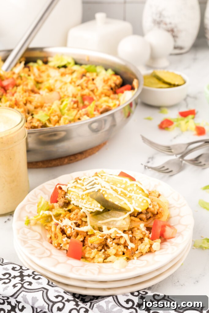 cheeseburger fried rice on plate with skillet in background
