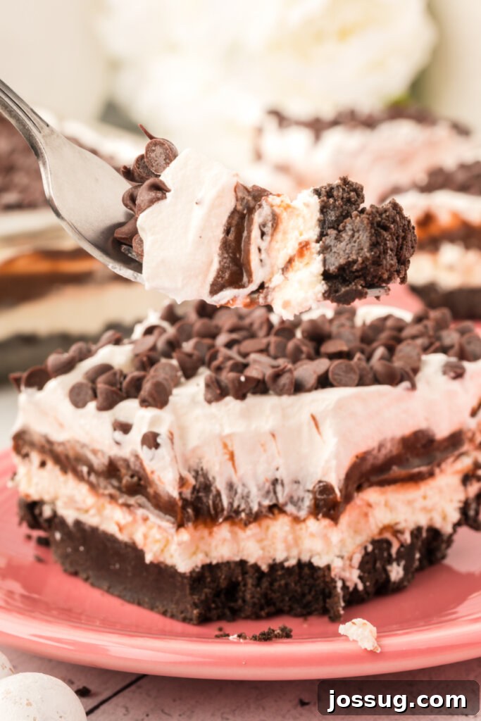 Chocolate Lasagna Delight 5 fork taking a scoop of chocolate lasagna lush