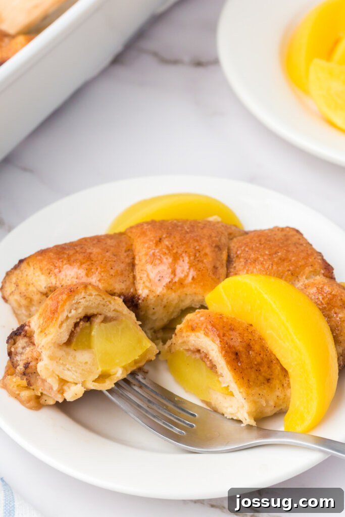 Golden-brown Peach Crescent Dumplings artfully arranged on a white plate, ready to be served.