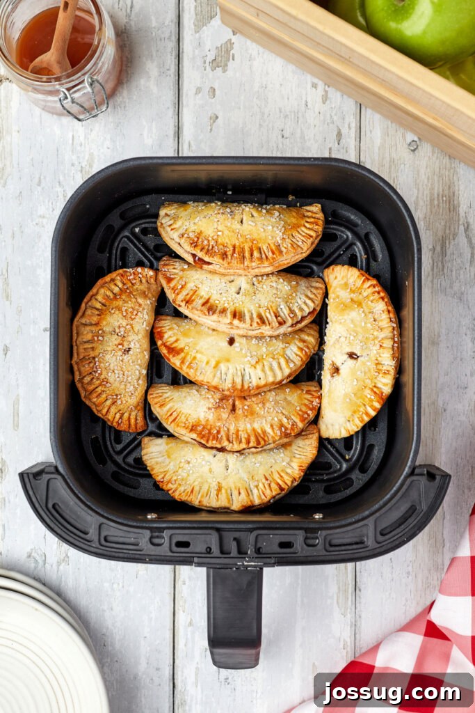 Golden Air Fryer Apple Hand Pies 5 hand pies in air fryer basket