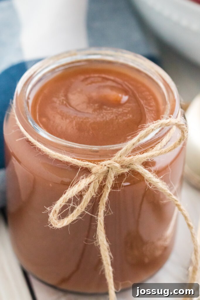 closeup of instant pot apple butter in glass jar
