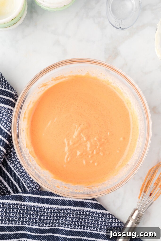 Irresistible Dipping Sauce 5 A mixing bowl with homemade Yum Yum Sauce after being thoroughly whisked, showing its smooth, consistent texture and inviting color.