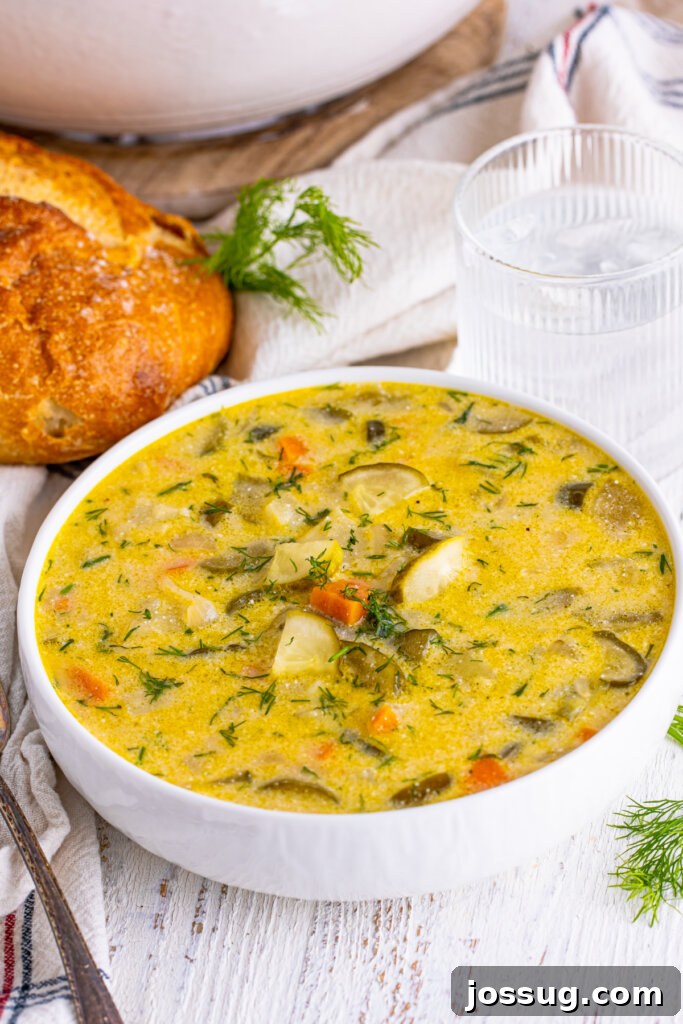 Creamy Dill Pickle Delight 2 A bowl of creamy dill pickle soup, garnished with fresh dill, ready to be enjoyed.