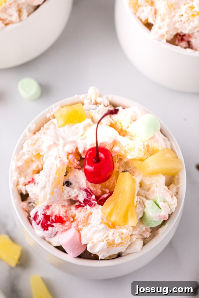 looking down into a bowl filled with creamy pineapple fluff