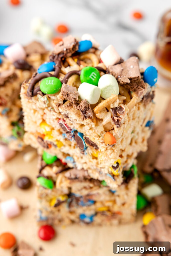 Buddy's Happy Holiday Crispy Treats 2 Two Buddy the Elf Rice Crispy Treats stacked, showcasing their colorful toppings and festive appearance, ready to spread holiday cheer.