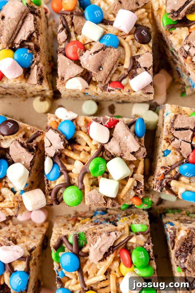 Buddy's Happy Holiday Crispy Treats 3 Neatly cut Buddy the Elf Rice Crispy Treats arranged on a platter, ready to be served as a festive holiday dessert.