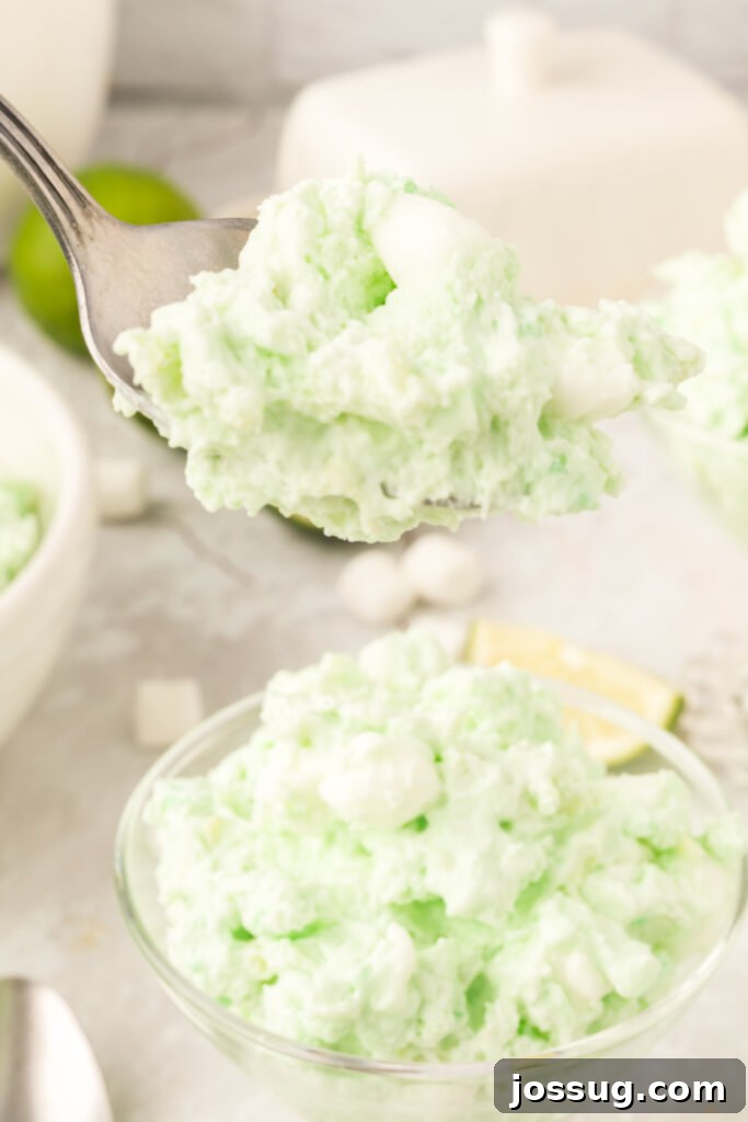 green fluff sald on spoon