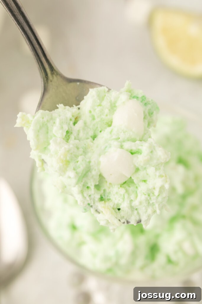 closeup of lime fluff salad on spoon