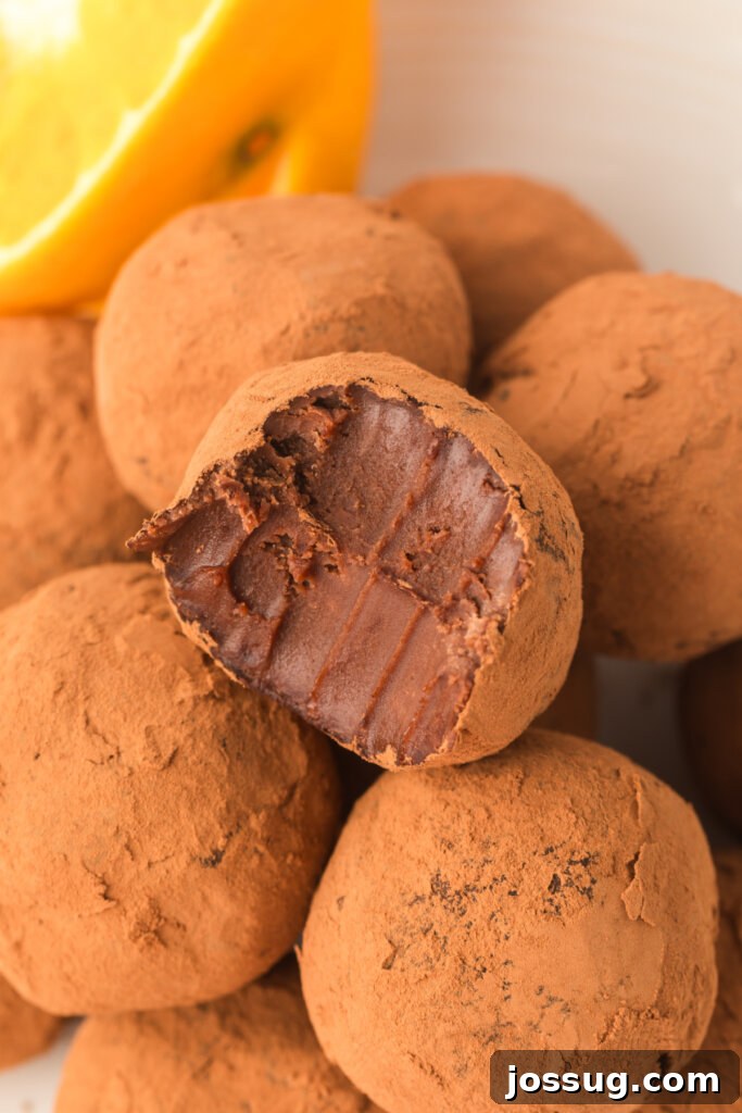 Homemade chocolate orange truffles stacked beautifully, ready to be enjoyed
