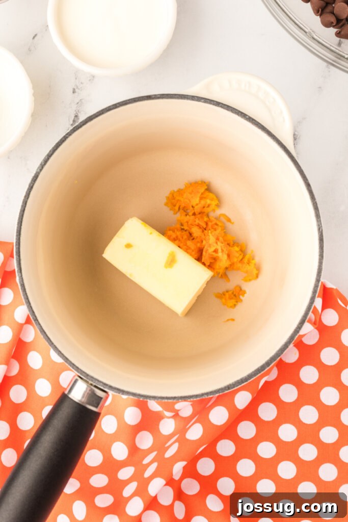 Butter and orange zest melting together in a small saucepan