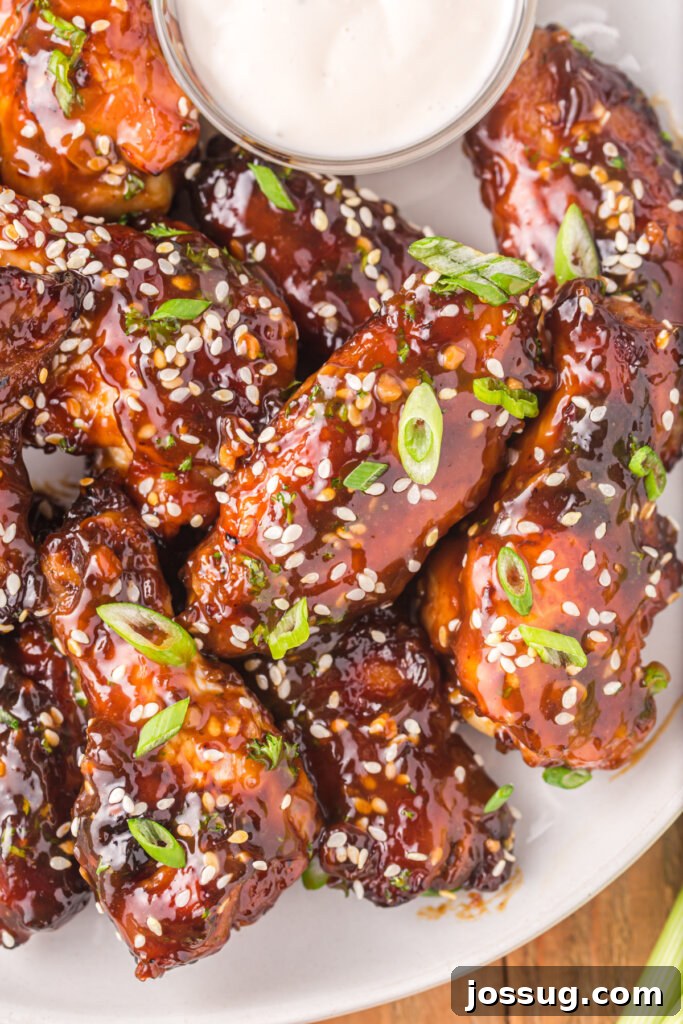 Crispy Sticky Teriyaki Air Fryer Wings 2 closeup of air fryer teriyaki chicken wings on plate