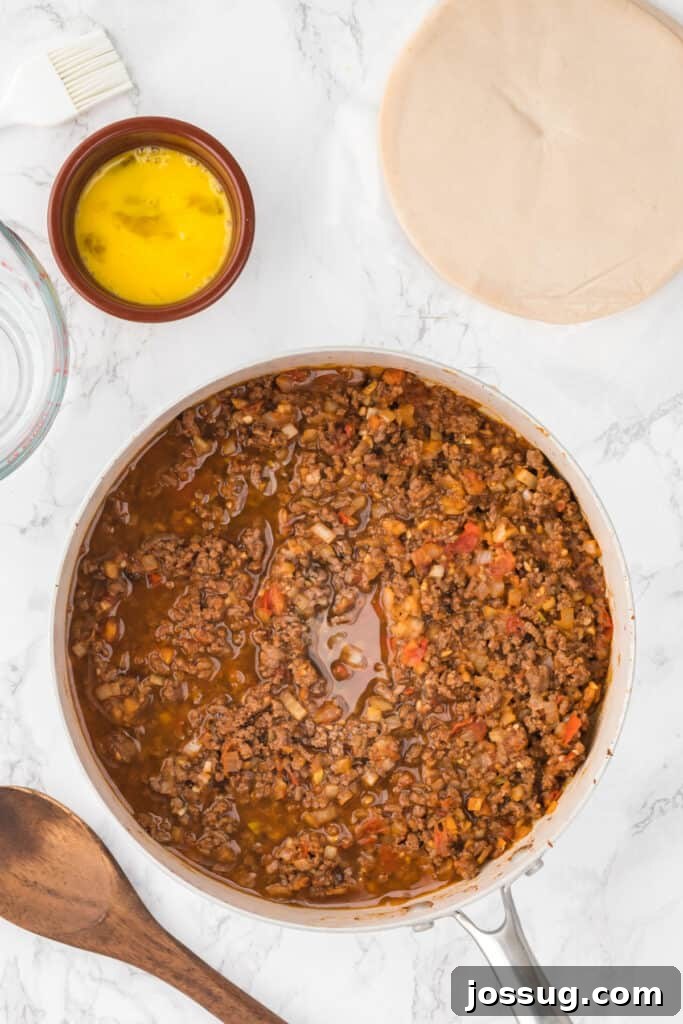 Crispy Air-Fried Beef Empanadas 7 Add beef broth to the skillet and simmer until the liquid has reduced and thickened slightly, about 5-7 minutes. Remove from heat and let cool.