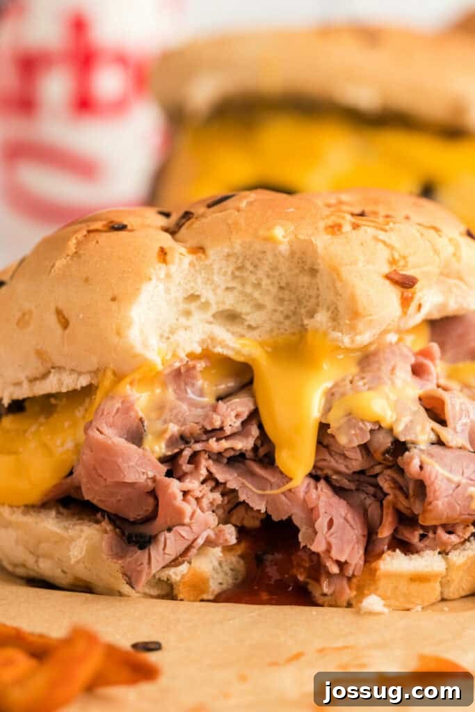 A delicious copycat Arby's Beef and Cheddar sandwich, perfectly assembled and ready for a bite.