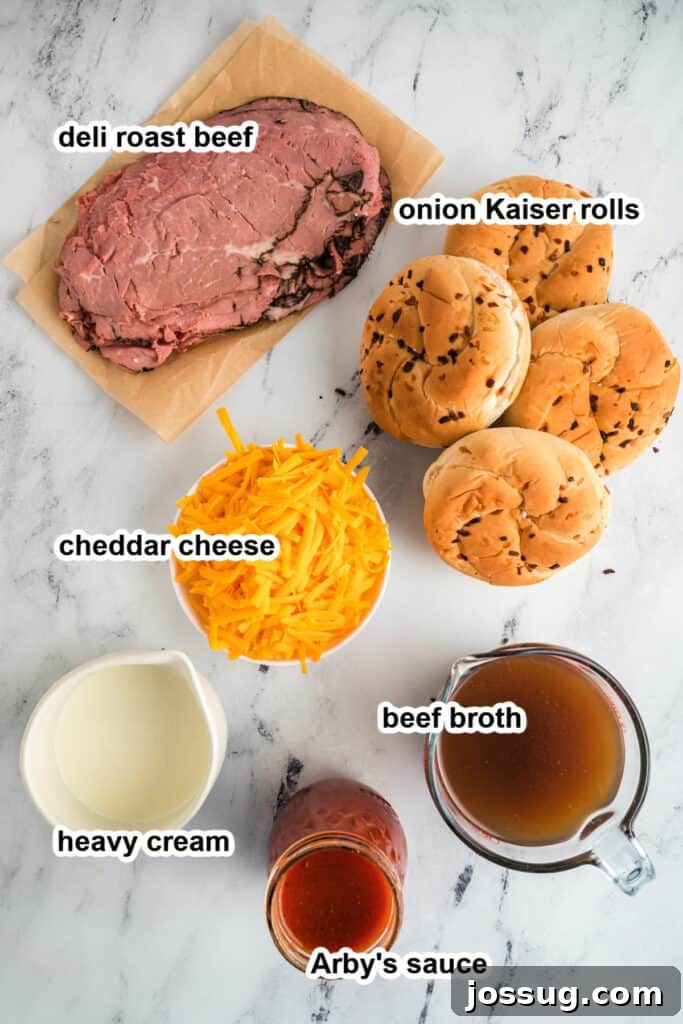 All essential ingredients for making homemade Arby's Beef and Cheddar sandwiches neatly arranged on a wooden board.