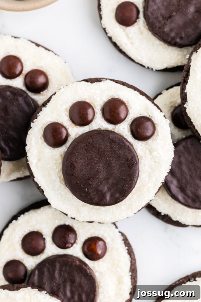 Arctic Paw Prints 3 Close-up of a perfectly decorated Polar Bear Paw Cookie, highlighting its fluffy texture and candy details