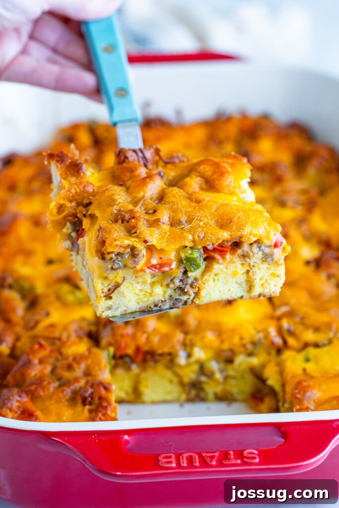 Make-Ahead Christmas Morning Strata 4 slice of breakfast casserole on spatula after being taken from pan
