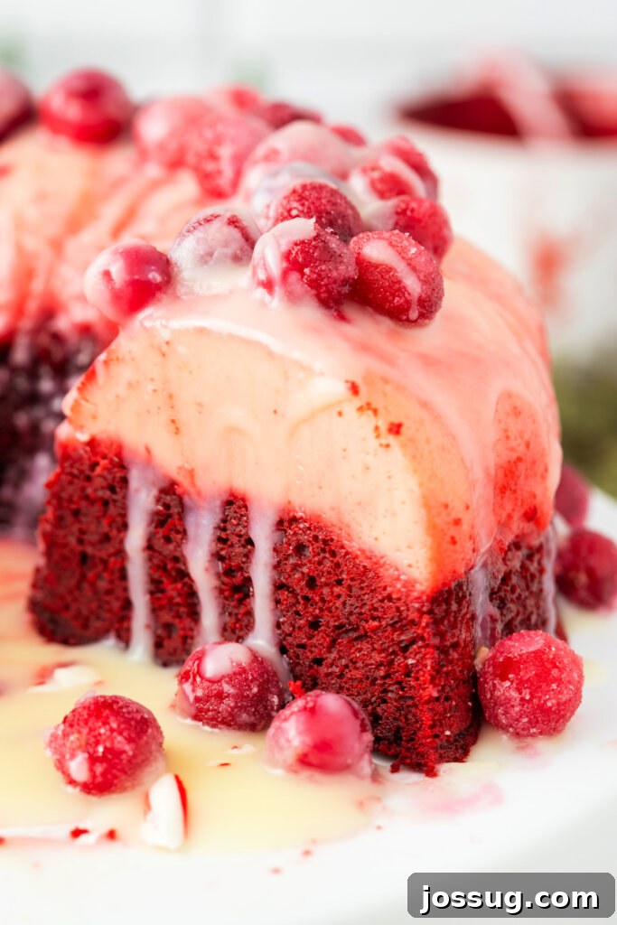 Holiday Red Velvet Flan Delight 4 Close-up shot of the layered Red Velvet Flan Holiday Cake on a cake stand, highlighting its vibrant colors.