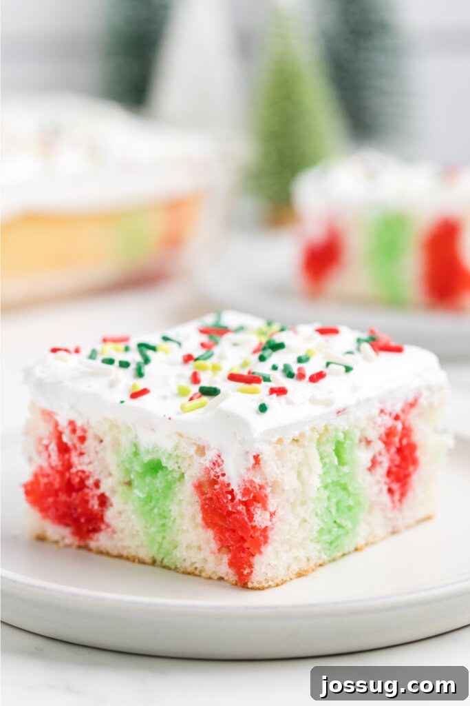 Festive Surprise Poke Cake 2 slice of christmas poke cake on white plate