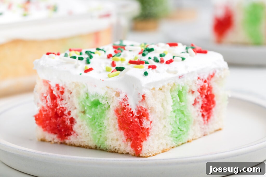Festive Surprise Poke Cake 14 slice of christmas poke cake on plate