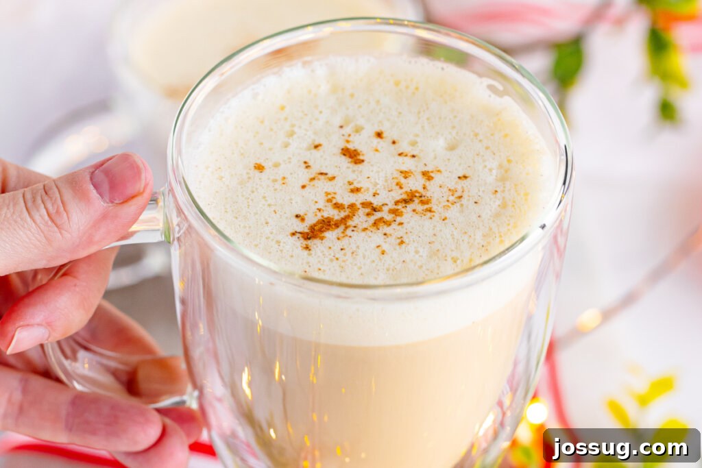 Yuletide Velvet Latte 6 A simple eggnog latte in a mug, showcasing its creamy texture.