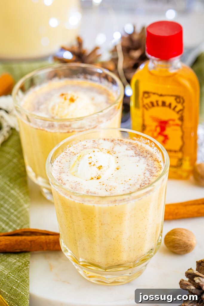Holiday Eggnog Cheer 4 fireball whiskey bottle and two glasses of eggnog punch