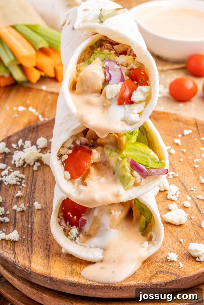 Spicy Buffalo Chicken Roll-Ups 3 three buffalo chicken wraps stacked on top of each other