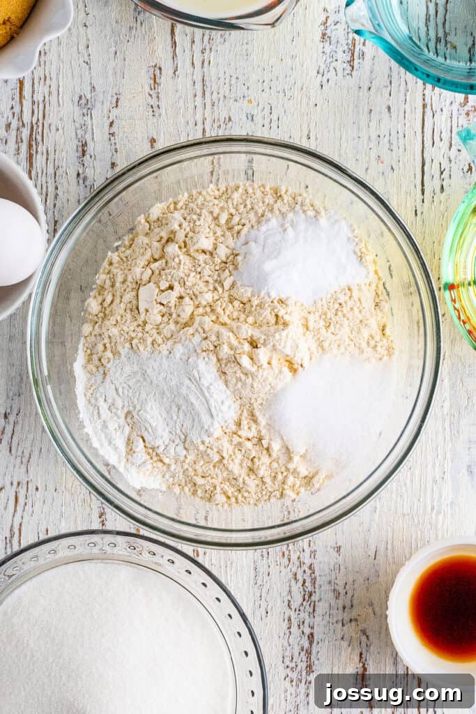 Chocolate Coconut Pecan Delight 5 Preheat the oven to 375°F. Lightly spray three 9-inch cake pans with baking spray. Place parchment paper in the bottom of the pan and set aside. In a large bowl, stir together the flour, baking powder, salt, and baking soda. Set aside.