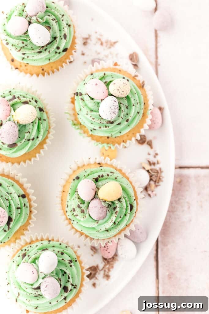 Hoppy Easter Vanilla Cupcakes 5 looking down on several vanilla easter cupcakes on a platter, perfectly arranged