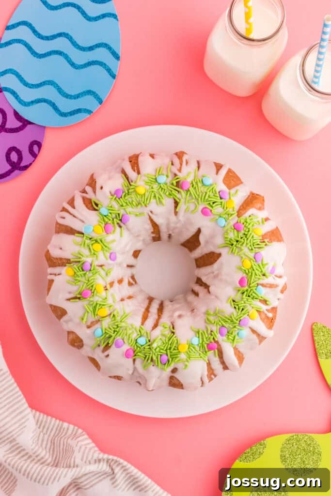 Top-down view of a colorful Easter Swirl Bundt Cake on a decorative plate, ready to be served