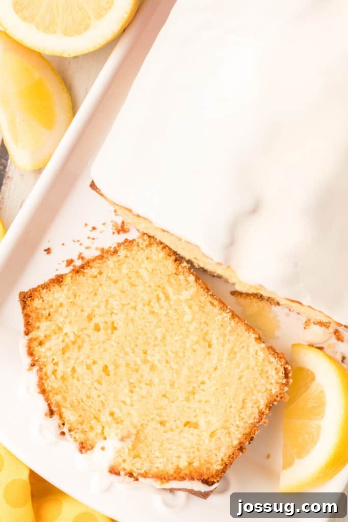 Signature Lemon Loaf 3 a perfect slice cut from a homemade lemon loaf, showing its moist texture