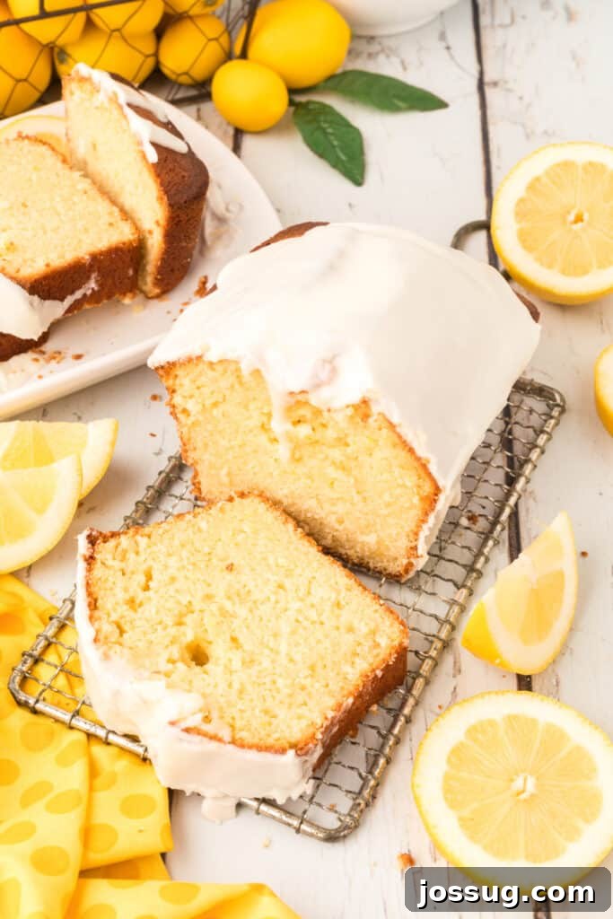 Signature Lemon Loaf 5 a whole glazed lemon loaf on a cooling rack, perfectly golden