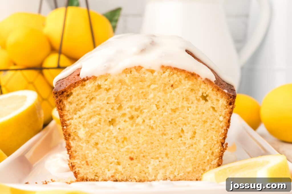 Signature Lemon Loaf 6 a delicious slice of homemade lemon loaf on a simple white plate